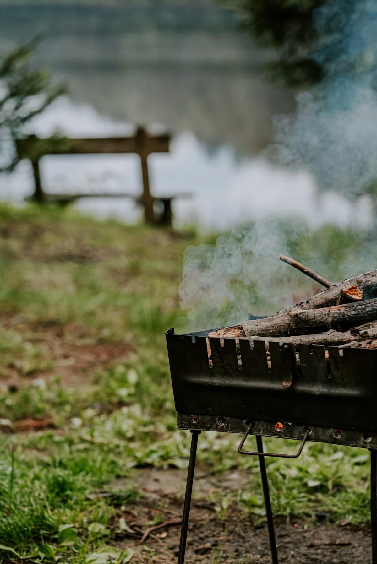 Smoke drifting from a pellet grill during a poultry cook