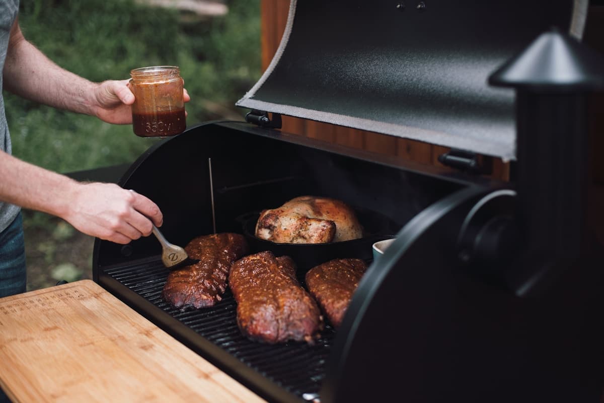Pellet grill on a patio running a long weekend cook