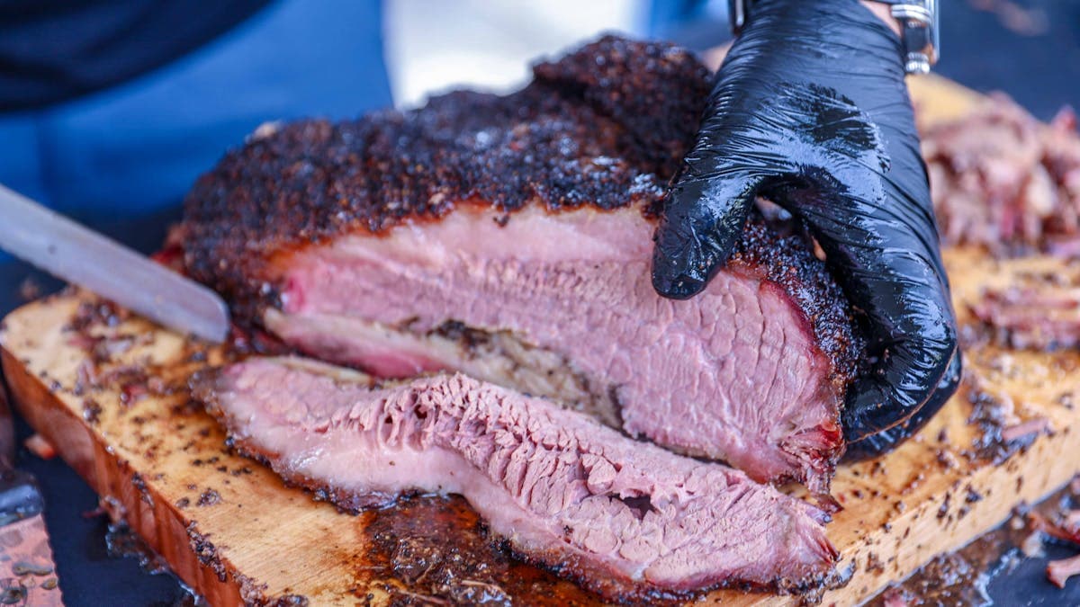 Slicing a perfectly smoked brisket