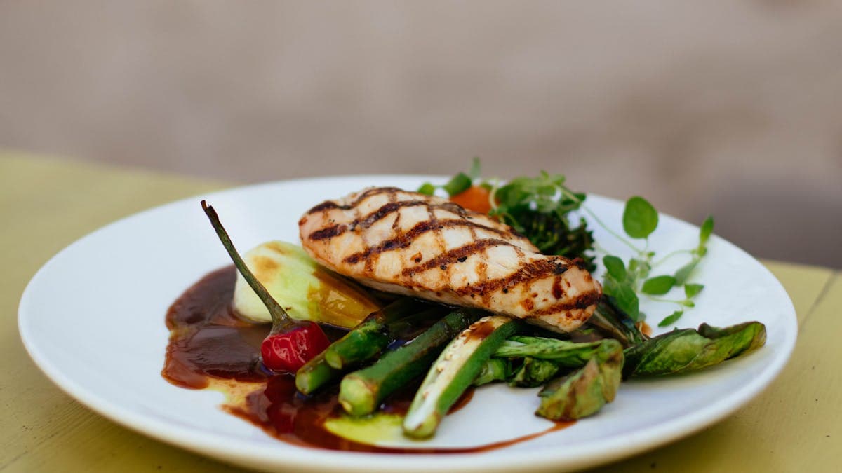 Juicy grilled chicken breast with vegetables