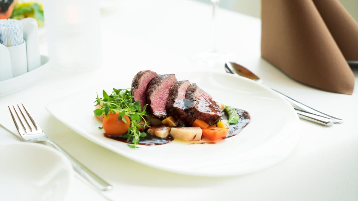 Sliced smoked tri-tip on a plate