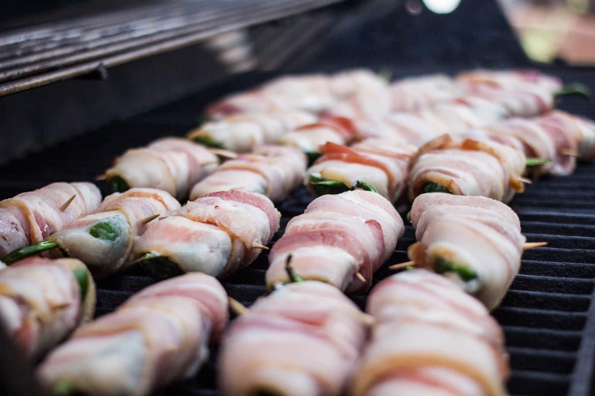 Bacon-wrapped jalapeno poppers on the grill