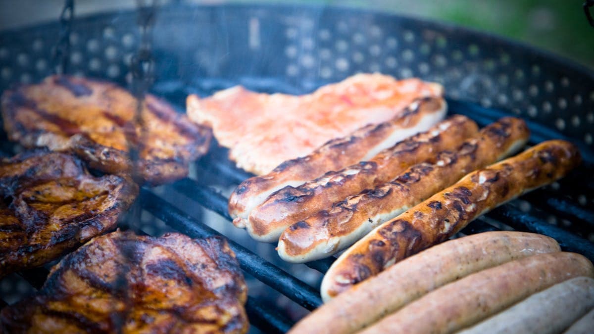 Homemade pizza cooking on a grill