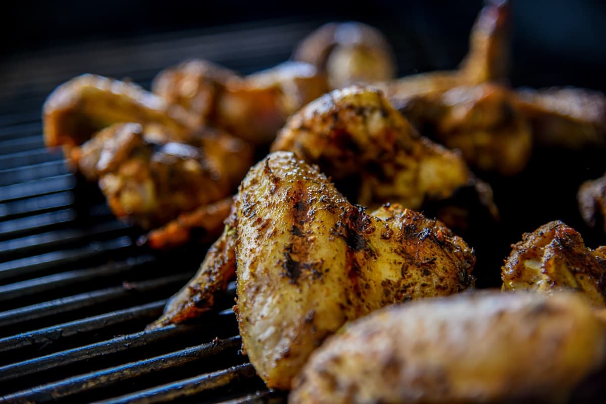 Crispy smoked chicken wings on the grill