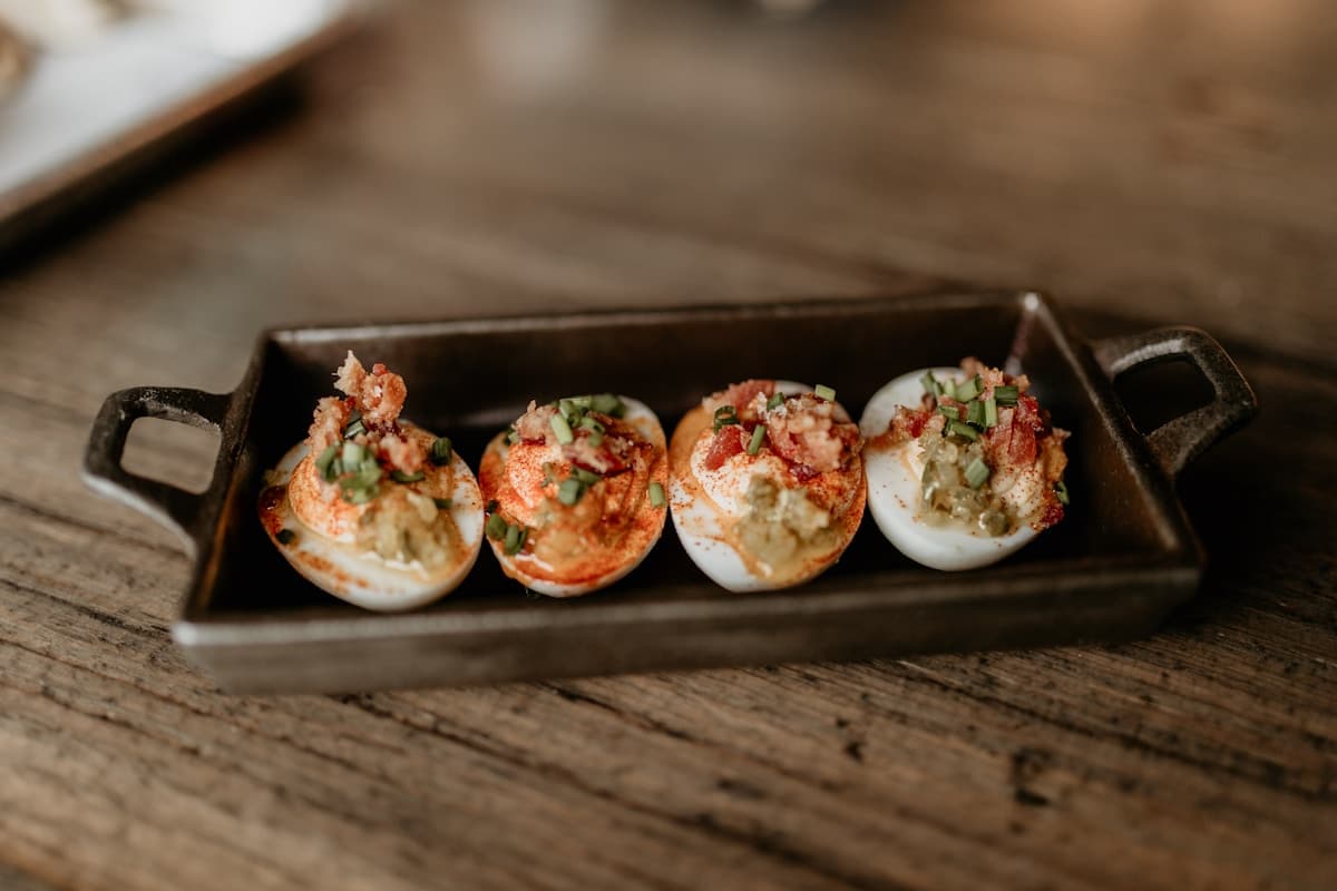 Smoked deviled eggs arranged on a serving tray